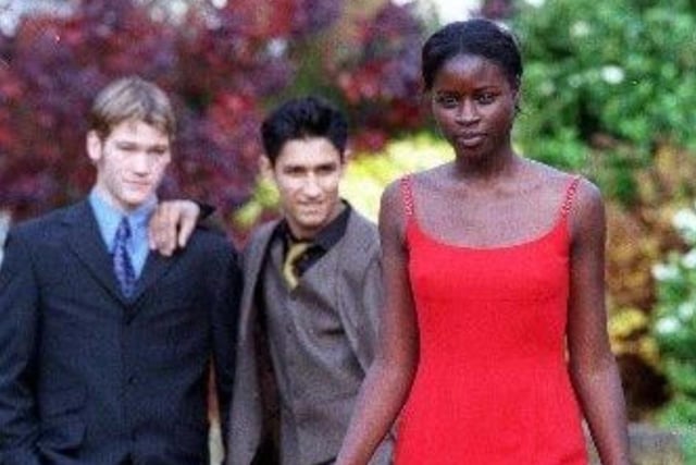 Students at Wakefield Girls High School wearing some of the fashions on show at their fashion show 1998, as Labo Ajulo, 16, wears a red dress watched by Oliver Hughes 17, (left) and Amandeep Khela 17.