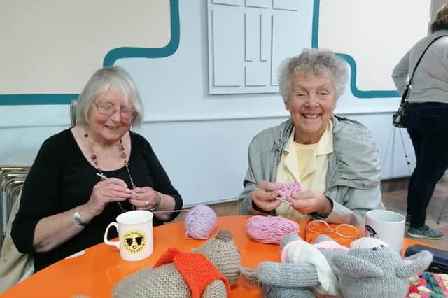 Jean and Sylvia crocheting together,