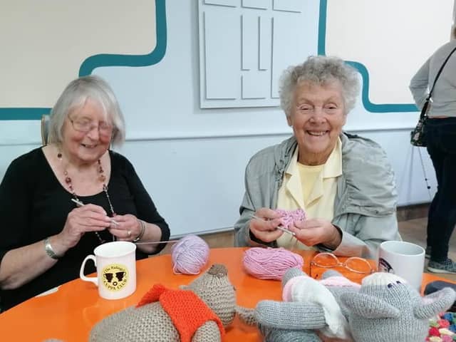 Jean and Sylvia crocheting together,