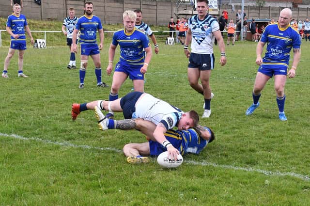 Joe Abson plants the ball down for a try for Normanton Knights against Beverley. Picture: Rob Hare
