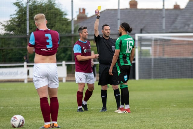 Calm is restored as a Golcar United player is shown a yellow card. Picture: Mark Parsons