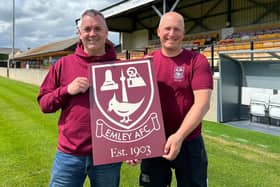 Emley AFC chairman Andrew Painten and vice-chairman Marcus Pound with an updated club crest to reflect the club’s history.