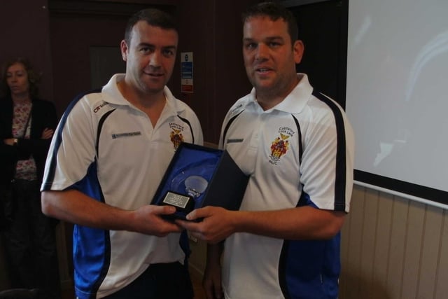 Mark Spears received his long service award after playing in 400 National Conference League games for Lock Lane. He is pictured with then club youth chairman Paul Couch.