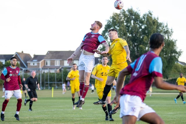 Emley centre-forward George Doyle challenges for the ball in the air. Picture: Mark Parsons