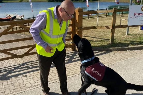 One of the volunteers with his hearing dog.