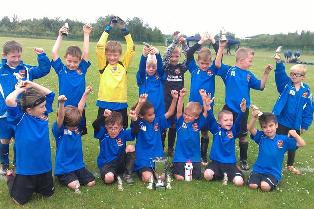 Pontefract Collieries U7s celebrate after beating Upton United in the summer league final. The impressive youngsters remained unbeaten throughout the tournament.