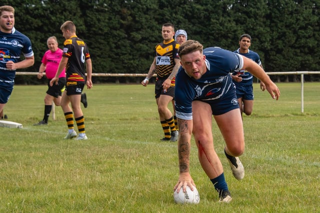 Jake Roberts touches the ball down for his first try for Featherstone Lions against Skirlaugh. Picture: Jonathan Buck