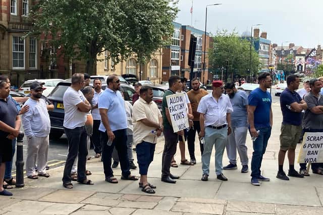 Taxi drivers staged a protest over licensing regulations outside Wakefield Town Hall in July.