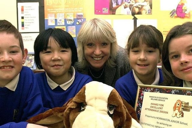 The Attendance Awards at Normanton Junior school in 2004, pictured with the award and Sam the Dog (L to R) are Anthony Thornton, Tina Tran, Mrs Margaret Broadbent (class teacher), Erica Lowe and Ebony Brumby