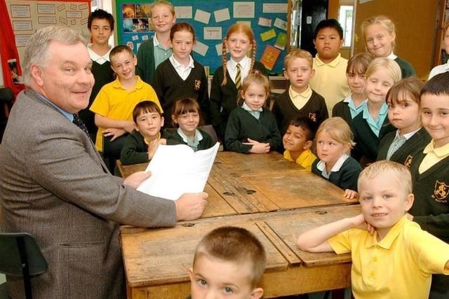Headteacher of St Austin's School David Willis reads the 2005 Ofsted report to some pupils.