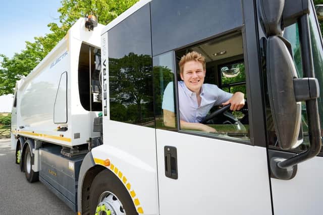 Wakefield Council Deputy Leader, Jack Hemingway, in an electric refuse truck, which is currently being trialled by the authority.
