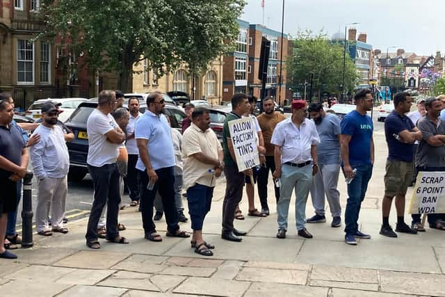 Taxi drivers protesting outside Wakefield Town Hall in July this year. Drivers have staged regular protests in the city for the past three years over the council's taxi driver suitability policy.