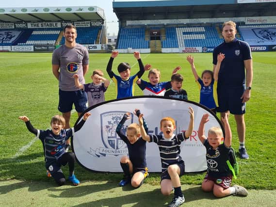 Throughout the Easter holidays, the Featherstone Rovers Foundation ran different activities for local children, pictured above with James Harrison and Craig Hall