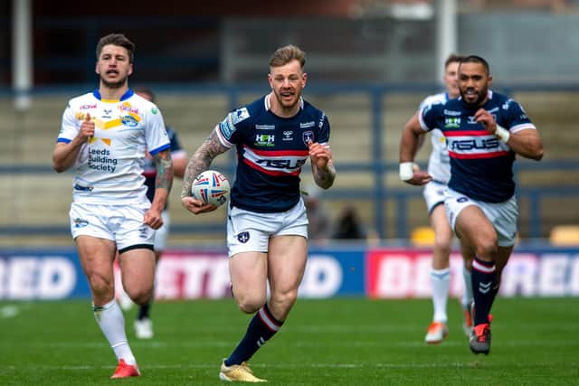 RUNNING FREE: Tom Johnstone runs through to score
 Wakefield Trinity's opening try against Leeds Rhinos.  Picture Bruce Rollinson