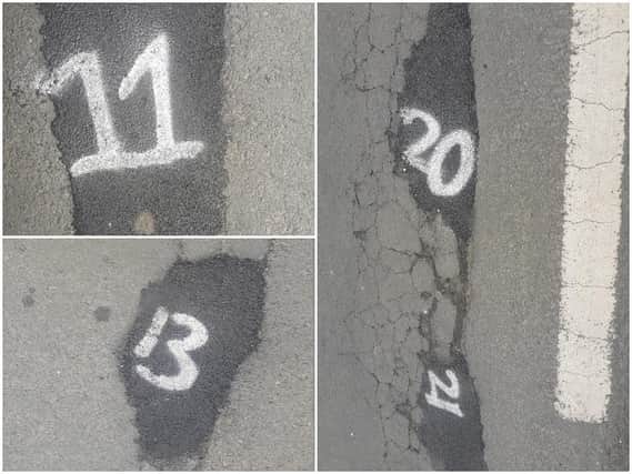 Some of the numbers spray-painted on filled-in potholes on Hall Road (photos submitted by Adrian Smith)