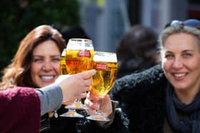 Friends enjoy a pint of Stella Artois amid the return of customers to the hospitality sector, following the latest lifting of restrictions. Photo: PA
