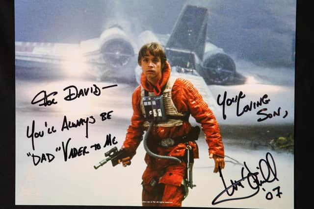 The incredible collection of over 700 items includes props and signed cards from co-stars like Luke Skywalker actor Mark Hamill - where he calls David 'dad'.