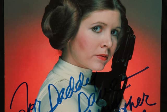 Carrie Fisher signed her Princess Leia photo.