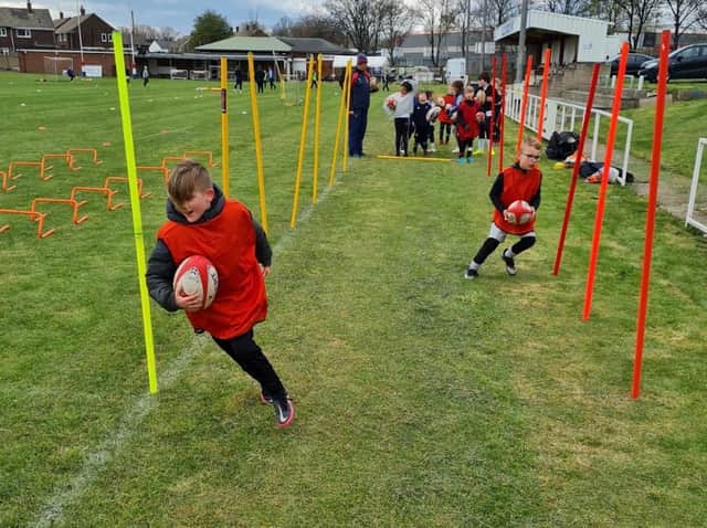 Youngsters pick up tips training at Castleford RUFC.