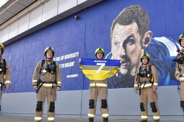 A group of firefighters from Leeds have raised more than £7,500 completing the Yorkshire Three Peaks Challenge, for Rob Burrows and to raise awareness of motor neurone disease (MND). Photo credit: West Yorkshire Fire and Rescue Service.