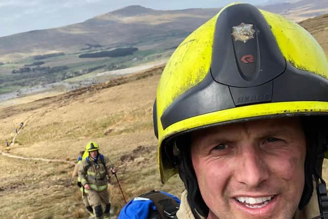 Pictured Mark Newton (front) a member of the five-strong Hunslet Fire Station crew who completed the 24-mile route between Pen-y-ghent and Ribblehead in their full firefighters kit to raise awareness of Motor Neurone Disease. Photo credit: West Yorkshire Fire and Rescue Service.