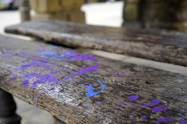 Paint has been strewn all over the benches, thought to be part of the original structure