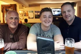 Family affair: John with his grandson Matty and son, Jonnny.
