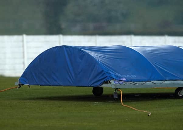 The covers go on as Altofts’ game is abandoned. The scene was the same at most grounds last Saturday. Picture: John Clifton