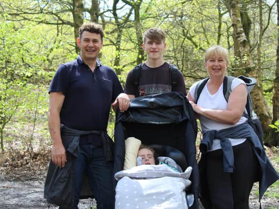 Lee, Elliot and Julie pictured with Holly - all in training for their climb up Pen-y-
ghent