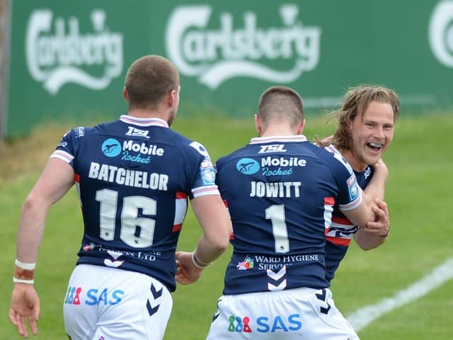Happy return: Wakefield Trinity's Jacob Miller celebrates after scoring a try on his return from injury, with Max Jowitt and James Batchelor.  Picture: 

Dean Williams