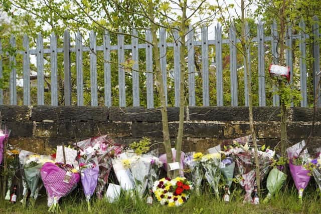 The floral tributes left in memory of the man who died.