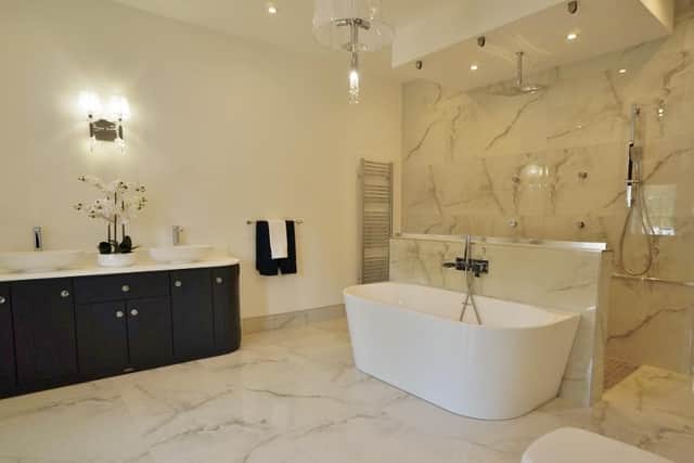 A luxurious, marble-styled bathroom