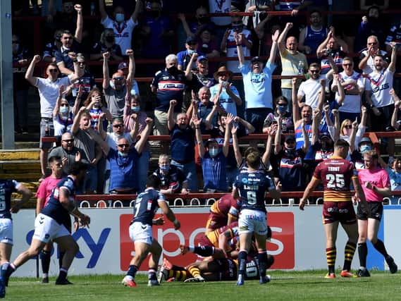 Trinity players and fans celebrate Joe Westerman's try against Giants. Picture by Simon Hulme.
