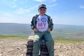 Little Jacob Newson, 7, climbed Ingleborough, Whernside and Pen-y-Ghent in the Yorkshire Dales in just under five hours.