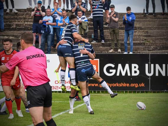 Featherstone players celebrate during their win over Widnes