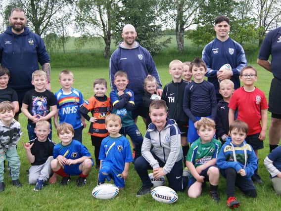 Featherstone Rovers stars Dean Parrata and John Davies at Hemsworth Dragons’ training night when they met the club’s ‘Baby Dragons’ juniors squad. Picture: Angie Breen