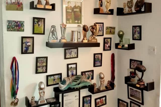 The rugby league wall at Harry's South Kirkby home with the boots in pride of place