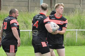 David Barker is congratulated on his try for Normanton Knights against Dewsbury Moor Maroons. Picture: Rob Hare