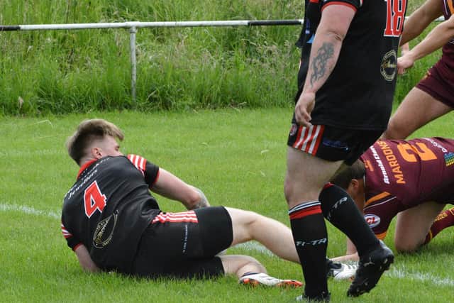 David Barker goes over for a try for Normanton Knights against Dewsbury Moor Maroons. Picture: Rob Hare