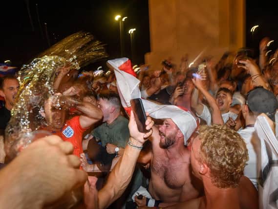 ENGLAND FANS: Celebrating after a win. Photo: Getty Images
