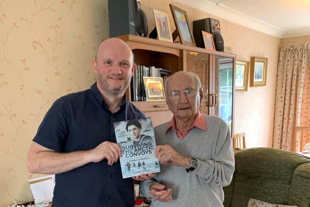Author John McKay and Charlie Erswell with a copy of the book about the Arctic Convoys of World War Two.