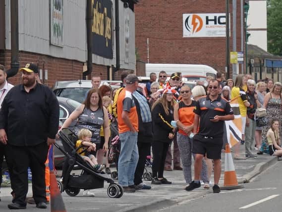 Fans gather on Wheldon Road to give the squad a good send off