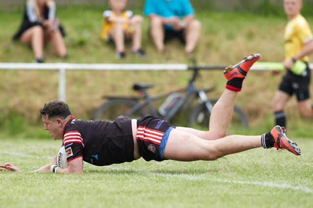 Normanton Knights' Bradley Westwood dives over for a try. Picture: John Clifton