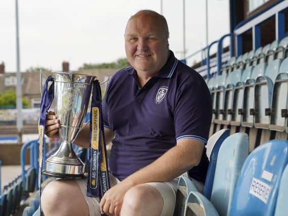 Featherstone Rovers chairman Mark Campbell with the 1895 cup the team won at Wembley.