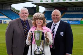 Coun Denise Jeffrey with Coun Graham Isherwood (left) and Featherstone Rovers chairman Mark Campbell with the 1895 trophy