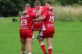 Fryston Warriors A teammates Tyler Czmeiduch (13) and Sam Dews (15) find the energy to carry their injured teammate Morgan Jones, who sprained his ankle, to a waiting car at the end of an energy-sapping game against Westgate Common A. Picture: Ken Czmeiduch