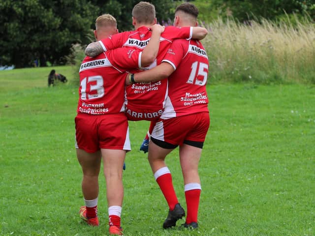 Fryston Warriors A teammates Tyler Czmeiduch (13) and Sam Dews (15) find the energy to carry their injured teammate Morgan Jones, who sprained his ankle, to a waiting car at the end of an energy-sapping game against Westgate Common A. Picture: Ken Czmeiduch