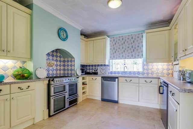The spacious fitted kitchen within the property