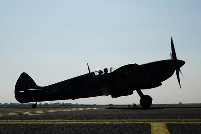A Spitfire gears up for take off.