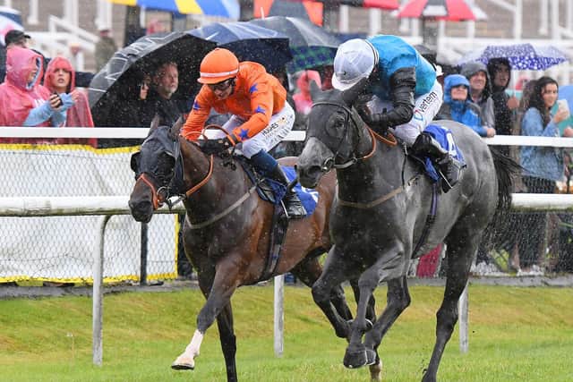Lasting Legacy comes out on top for jockey PJ McDonald, in the Bet with Jayne Bookmaker Handicap at a wet Pontefract Racecourse. Picture: Alan Wright